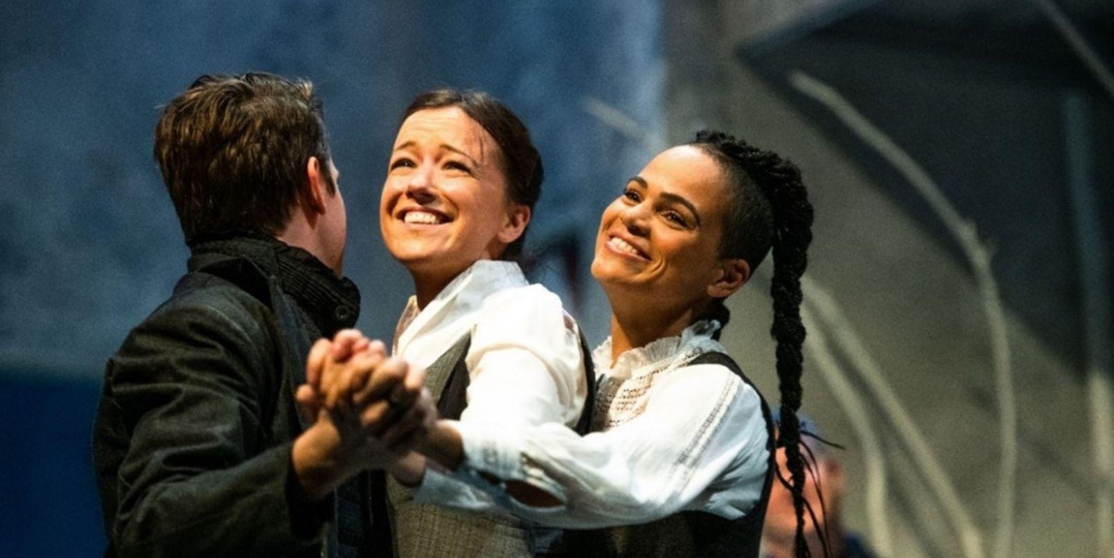 From Frankenstein, three performers hold hands