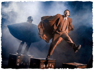 Man being chased over suitcases by policeman in the mist