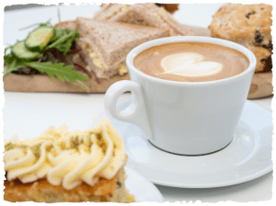 Hot chocolate, lemon cake, sandwiches