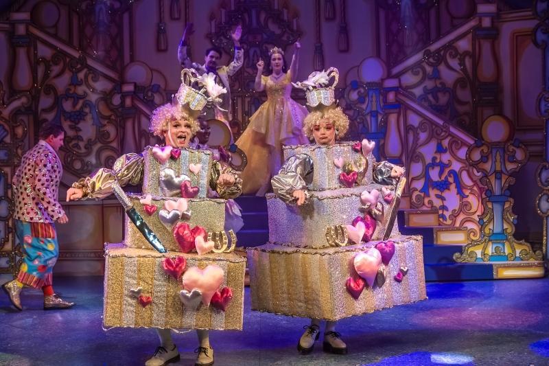 Two pantomime dames in wedding cake costume