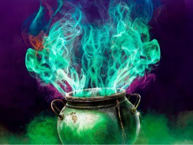 A cauldron with green and purple fire flying out the top