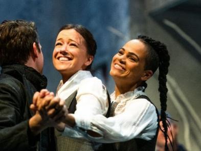 From Frankenstein, three performers hold hands