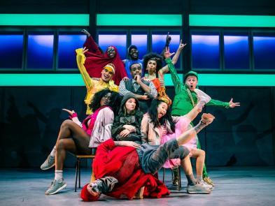 Group of performers posing a breakdancing